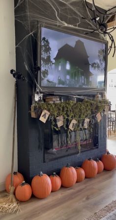 a living room decorated for halloween with pumpkins