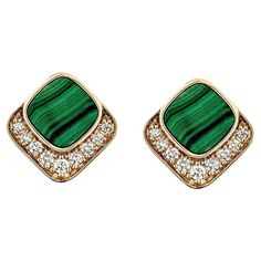 This Malachite earrings pair is a stunning piece featuring a cushion-shaped, brilliant green malachite gemstone framed by a halo of glittering diamonds. The diamonds add a radiant shine and enhance the natural beauty of the earring, creating a tasteful combination of color and sparkle. Crafted in 18-karat gold, this earrings pair adds elegance to your look, making it perfect for both special occasions and daily wear. Malachite Stud Earring in 18Karat Rose Gold with White Diamond. Malachite: 1.46 carat, 7X7mm size, cushion shape White Diamond: 0.05 carat, 1.80mm size, round shape, G color, VS clarity. White Diamond: 0.14 carat, 1.60mm size, round shape, G color, VS clarity. White Diamond: 0.05 carat, 1.40mm size, round shape, G color, VS clarity. White Diamond: 0.03 carat, 1.20mm size, roun Malachite Stud Earrings, Malachite Earrings, Malachite Rings, Green Malachite, Malachite Stone, Diamond Glitter, Gold Earrings Designs, Naha, Modern Earrings