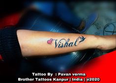 a person with a tattoo on their arm that reads visah, brother tattoos kanpur india