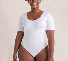 Expect an instant dose of confidence when you wear this short-sleeve bodysuit under everything from your power suit to a pretty printed dress. Providing comfortable control, this versatile piece of shapewear offers light arm smoothing and an extended gusset that's easy to snap on and off. Only you will know the secret to your sleek silhouette! From Shapermint. All Day Everyday, Power Suit, Short Sleeve Bodysuit, Printed Dress, Shapewear, The Secret, Sleek, Confidence, How To Wear