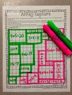 two crayons are sitting on top of a crossword puzzle game with numbers