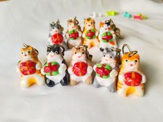 a bunch of small figurines that are sitting on a table with some beads