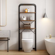 a white toilet sitting next to a bath tub in a bathroom under a light fixture