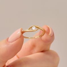 Ward off negativity and embrace style with this Diamond Minimal Evil Eye Ring. Crafted in 14k gold, this exquisite piece serves as a symbol of protection and good luck. The evil eye design features a bezel-set diamond at its center, adding a touch of sparkle to your daily look. Ring Details * 14k Solid Gold (also in 10k,18k ) * Band Options; Yellow Gold, White Gold Rose Gold * Band Width: 1.58 mm * Top Width: 4.61 mm * Thickness: 1.38 mm * Gemstone: Genuine White Diamond * Gem Color and Clarity: 14k Gold Jewelry With Tension Setting, Gold Stackable Rings With Tension Setting, Modern Birthstone Ring With Prong Setting For Promise, Modern Promise Ring With Prong-set Birthstone, Modern Rose Gold Diamond Ring With Bezel Setting, 14k Gold Rings With Tension Setting And Modern Twist, Gift Diamond Birthstone Ring With Bezel Setting, Modern Twist Rings With Brilliant Cut For Gift, Brilliant Cut Rings Modern Style Gift