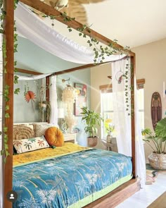 a bedroom with a canopy bed and plants on the wall