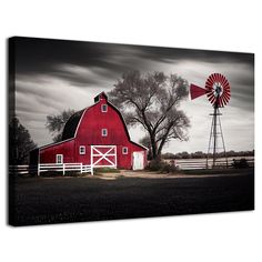 a red barn and windmill on a cloudy day