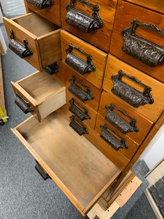 an old wooden dresser with lots of drawers