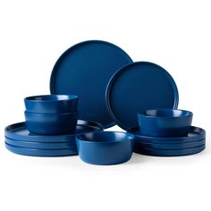 the blue dinnerware is set on top of each other, with one bowl and two plates