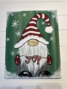 a painting of a santa clause with snowflakes on it's head and the word joy