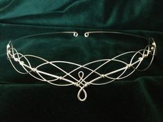 Beautiful handmade silver plated circlet crafted from just two lengths of wire to emulate traditional Celtic knotwork. Designed to be worn on the forehead, the circlet is open at the back with loops which allow ribbon or cords to be attached to enable the circlet to be held in place. It can also be pinned into place if preferred. The circlet is flexible and very comfortable to wear. The design element of the circlet measures 21cms (8 and a quarter inches) across and 2.5cms (1 inch) from top to b Wedding Circlet, Bridal Circlet, Boho Tiara, Elven Wedding, Wedding Woodland, Pagan Wedding, Boho Headpiece, Tiara Headpieces, Wedding Headdress