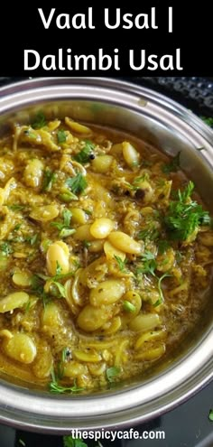 a close up of a bowl of food on a table with the words vaal usal