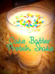 cake batter protein shake in a glass with sprinkles