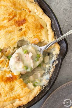 a cast iron skillet with chicken pot pie in it and the title overlay reads cast iron skillet chicken pot pie