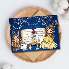 a card with an image of princesses and the story behind it on top of a wooden plate