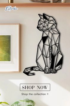 a cat is shown on the wall next to a plant and framed photograph with text shop now