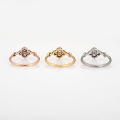 Pre owned set of 3 Cartier Hindu diamond rings crafted in 18 karat white, rose and yellow gold.    Twelve round brilliant cut diamonds (4 per ring) total an estimated 0.36 carats (estimated at F-G colour and VVS2 clarity).  The out of production Cartier rings feature a floral motif. Quite a rare find as a set of 3, the rings are typically found as a single ring. The rings are petite in scale and are great worn alone or layered with your fine jewellery from any era. Makes a fun stack on the pinky Elegant Cartier Rose Gold Rings, White Cartier Diamond Ring With Accents, Cartier White Diamond Ring With Accents, Cartier White Gold Diamond Ring With Prong Setting, Cartier White Diamond Wedding Ring, Cartier Yellow Gold Round Cut Rings, Elegant Cartier Diamond Ring With Prong Setting, Cartier Yellow Gold Wedding Diamond Ring, Cartier Yellow Gold Diamond Wedding Ring