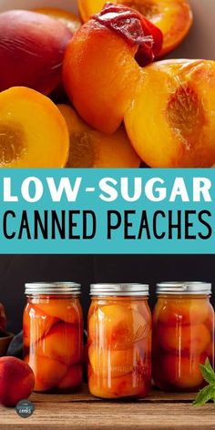 jars filled with sliced peaches sitting on top of a wooden table next to fruit