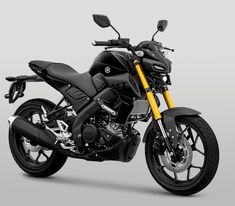 a black and yellow motorcycle is shown on a gray background