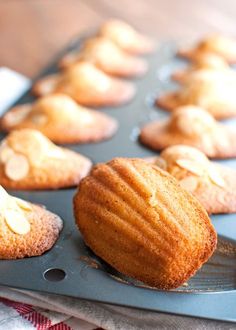 muffins are lined up and ready to be baked in the oven on a baking tray