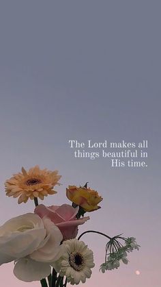 a vase filled with flowers on top of a table next to a quote that reads, the lord makes all things beautiful in his time