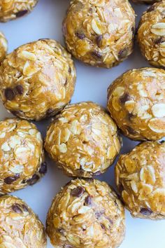 several balls of granola and oatmeal sitting on a white table top