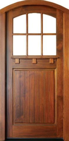 a wooden door with an arched glass