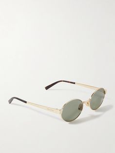 SAINT LAURENT Eyewear's oval-frame sunglasses have an impossibly cool, retro feel - it's easy to imagine the frontwoman of a rock band wearing them in the '60s. They're made from gold-tone metal with smoky lenses and tortoiseshell acetate arms. Eye Accessories, Oval Glasses Frames, Fancy Glasses, Ysl Sunglasses, Classic Coastal, Oval Glasses, Saint Laurent Sunglasses, Bold Accessories, Stylish Glasses