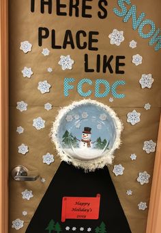 there is a snow globe on top of a door that says, there's place like foc