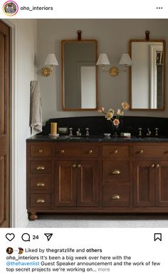 an image of a bathroom with double sinks and large mirrors on the wall above it