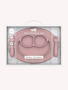 the mini feeding set in pink is packaged with two forks, spoons and utensils