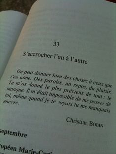 an open book with some writing on it's pages and the words in french