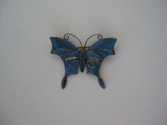 Antique Chinese Kingfisher Butterfly Brooch Dynasty Bird Feather Inlay Blue Vintage Excellent Condition Materials: light gold tone & Kingfisher bird feather Condition: excellent vintage/antique with very light wear Size in inches: H - 1 5/8 W - 2 Maker's mark: none Questions welcome Antique Handmade Blue Brooches, Formal Blue Handmade Brooches, Elegant Blue Butterfly Brooches, Kingfisher Bird, Bird Feather, Butterfly Brooch, Glass Perfume Bottle, Maker's Mark, Kingfisher