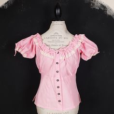 "This is a nice vintage Dirndl blouse. The blouse is made of cotton, has a wonderful flattering cit, off white lace detailing. MAKE: Most likely made in Austria or Germany.  CONDITION: Excellent. MATERIAL: 100% cotton. MEASUREMENTS NOTE: Please refer to the exact measurements and sizing table I used, as this one does not have size labels! The mannequin is size S. Bust: 110cm/43\" Waist: 80cm/31\" Sleeve: 20cm/8\" Length: 56cm/22\" All my items are preloved vintage and retro items, unless stated differently. Colours may look different on each viewing screen. All items are sold \"as is\" so if you have any additional questions about this item, please don't hesitate to ask before purchasing. My passion is hunting for interesting, unique and vintage items for you to loveHave a look at my other Vintage Cotton Top With Square Neck, Vintage Square Neck Tops For Spring, Feminine Square Neck Peasant Top For Summer, Fitted Square Neck Peasant Top With Ruffles, Vintage Ruffled Square Neck Tops, Vintage Square Neck Blouse For Spring, Feminine Swiss Dot Tops For Summer, Vintage Tops With Ruffles And Square Neck, Vintage Square Neck Tops With Ruffles