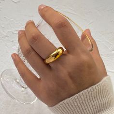 Elevate your style with the Gold Dome Ring, crafted with 18k gold-filled for a luxurious finish. This ring features a sleek, rounded dome, blending timeless elegance with modern sophistication. Gold Dome Ring, Feminine Jewelry, Dome Ring, 18k Gold Jewelry, Chunky Rings, Sleek Style, Domed Ring, Plated Jewelry, Sleek Fashion