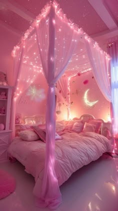 a pink bedroom decorated with fairy lights and canopy bed, white comforter on the floor