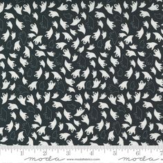 a black and white fabric with cats on it