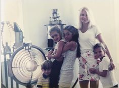 two women and three children posing for a photo