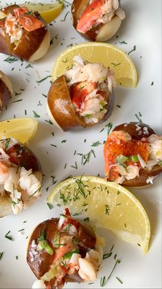 lobster stuffed potatoes with lemon wedges and garnish on white platter, ready to be eaten