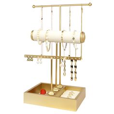 a jewelry holder with two necklaces and earrings