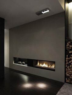 an empty room with a fire place in it