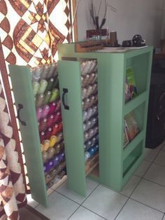 a green cabinet filled with lots of different colored items