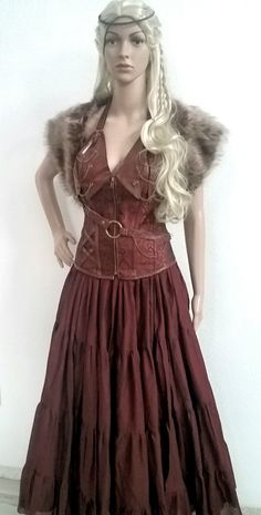 "Viking Lagertha Warrior Corset & Fur Capelet Your Choice; Corset or Corset & Fur Capelet CORSET; 14 Spiral Steel Bones Halter Design Back Design: Lace up, With Extra Cover Material at the back. Length ; Center Front: 12\", Length from Top to Hem: 17\", Side Length: 12.5\", Center Back: 12\". It is shaped for a more flattering silhouette and for waist training. 14 Steele bones gives you super strong support for a perfectly defined hourglass shape! FUR CAPELET; Authentic, Professional, Th Lagertha Warrior, Viking Lagertha, Esmeralda Costume, Fur Capelet, Vikings Lagertha, Warrior Costume, Viking Dress, Viking Costume, Corset Skirt