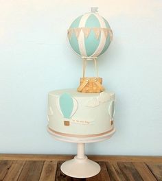 there is a cake with a hot air balloon on top