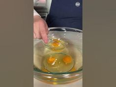 two eggs are being beaten in a bowl