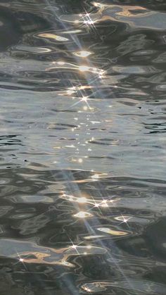 the sun shines brightly through the water