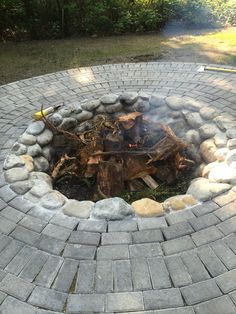 a fire pit made out of bricks and stones