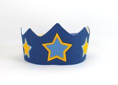 a blue crown with yellow stars on it