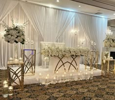 an elegant wedding setup with candles and flowers