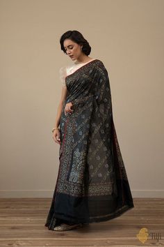 Yamini - A touch of vintage, a thing of beauty, the perfect piece of heritage luxury! This is a regal Banarasi beauty, handwoven in the sublime Ektara style in real zari. An exquisite aadha jaal, patterned with bootis, a koniya aanchal and the sublime Dampach weave, for timeless elegance. Black Pure, A Thing Of Beauty, Katan Silk, Shades Of Black