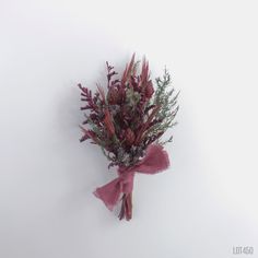 a bouquet of dried flowers on a white background